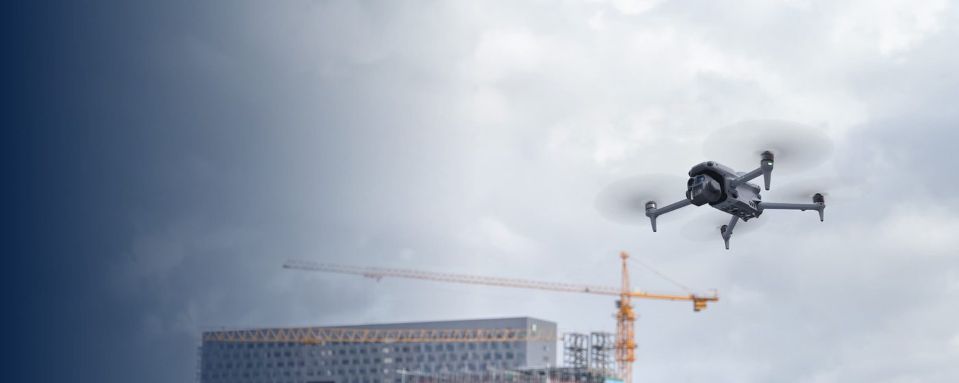 DJI thermal drone in flight over commercial construction site